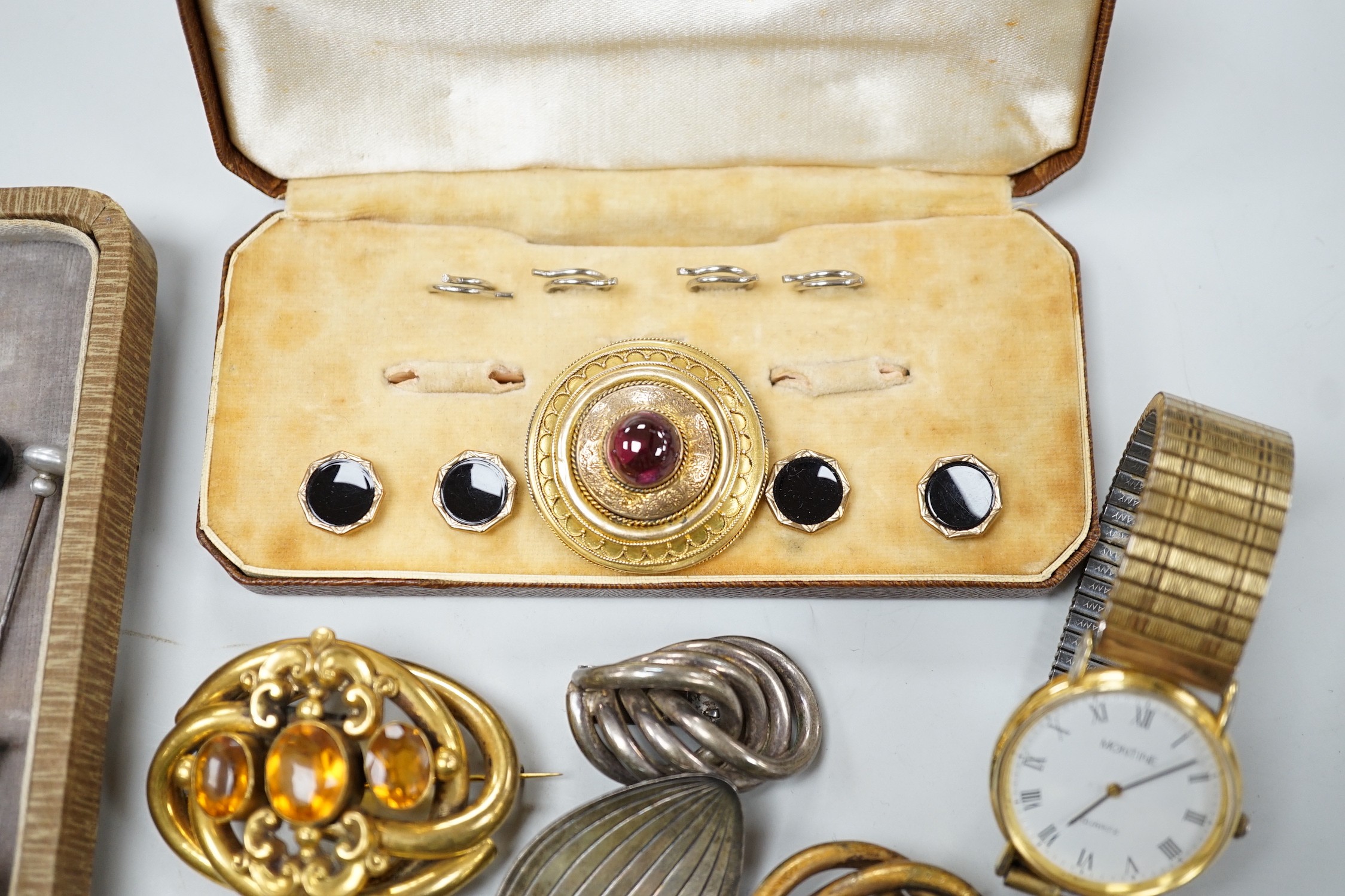 A Victorian yellow metal and cabochon garnet set brooch, with cannetlie work decoration, 34mm, a silver albert and a quantity of assorted minor costume jewellery.